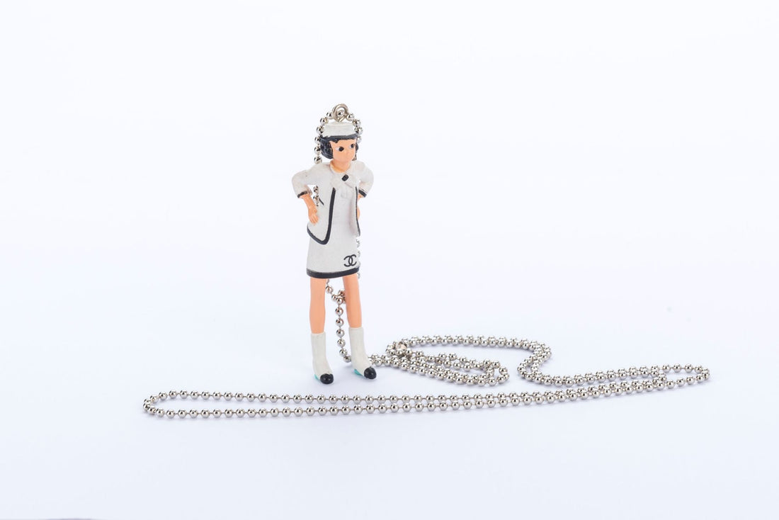 Chanel Coco Doll Pendant Necklace with Comic Book, Dust Cover & Box