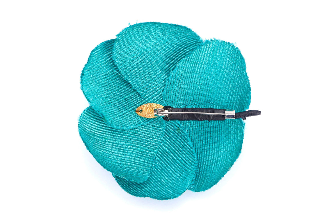 CHANEL GREEN CANVAS CAMELIA BROOCH, WITH BOX