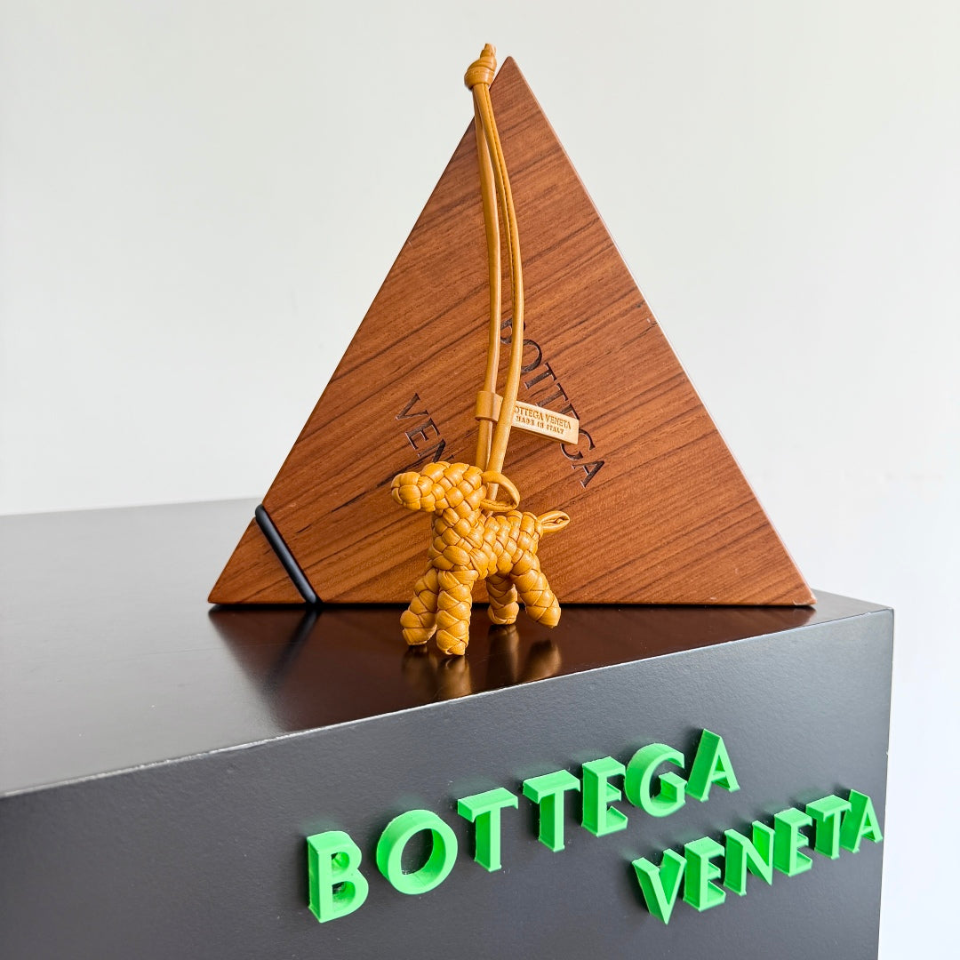 BOTTEGA VENETA 25S DOG CHARM IN BURNT ORANGE CALFSKIN House Of Sarah